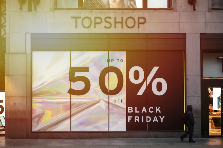 Banner outside Topshop advertising 20% off for Black Friday