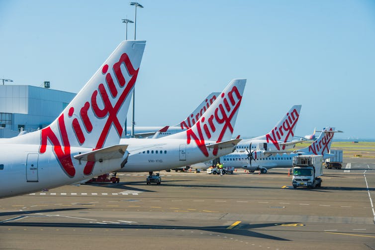 Virgin planes line up on the tarmac.
