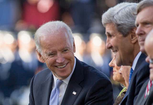 Then-Vice President Joe Biden talks with John Kerry in 2015.