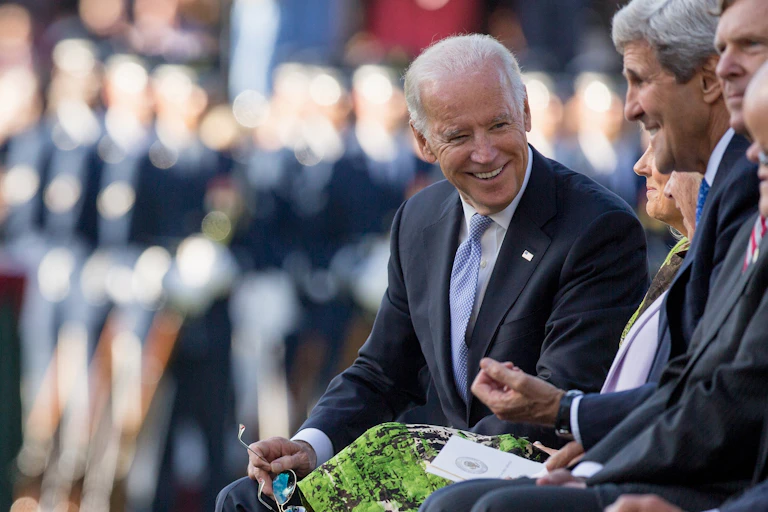 Then-Vice President Joe Biden talks with John Kerry in 2015.