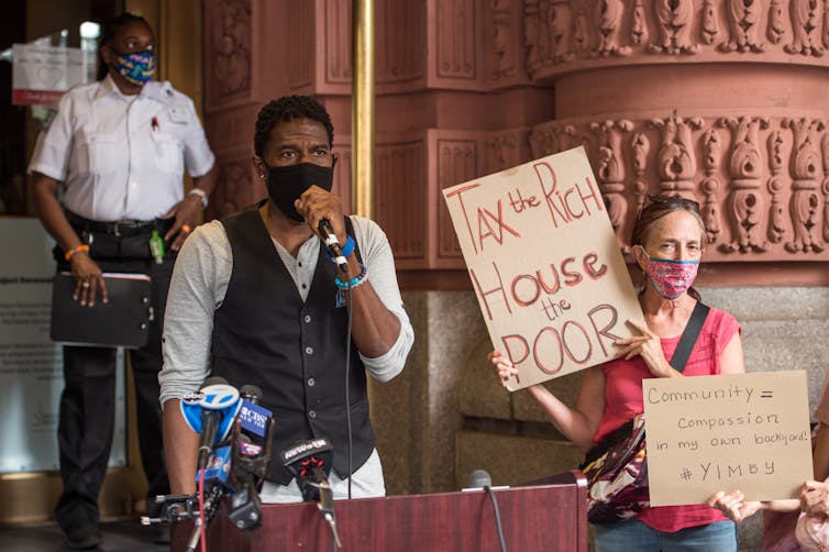 A protest supporting the homeless men given temporary living quarters at a New York City hotel in the Upper West Side.