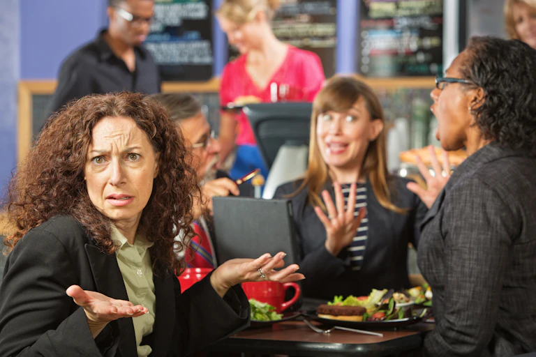 Image of people arguing over lunch.