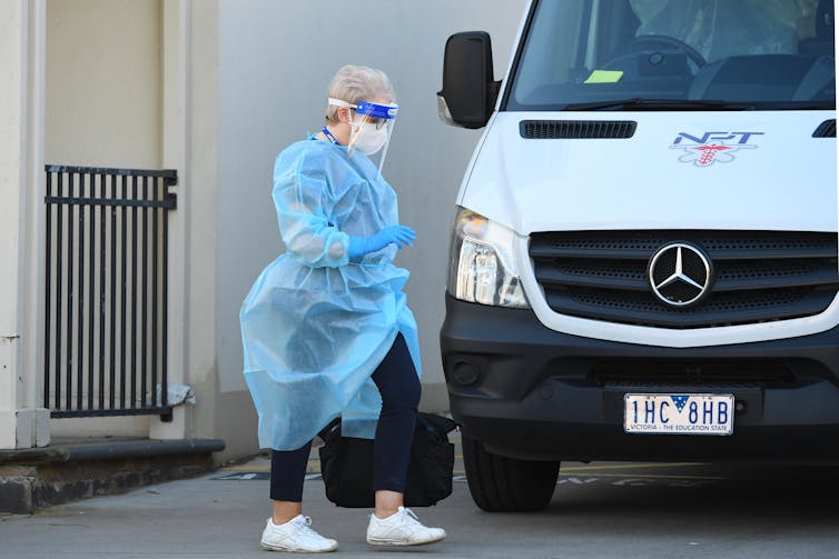An aged care worker wearing personal protective equipment