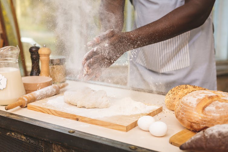 Hands baking bread