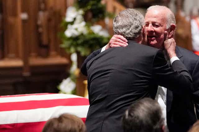 Former President George W. Bush, left, with James A. Baker III at the funeral of George H.W. Bush.