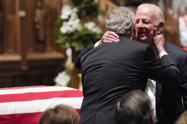 Former President George W. Bush, left, with James A. Baker III at the funeral of George H.W. Bush.