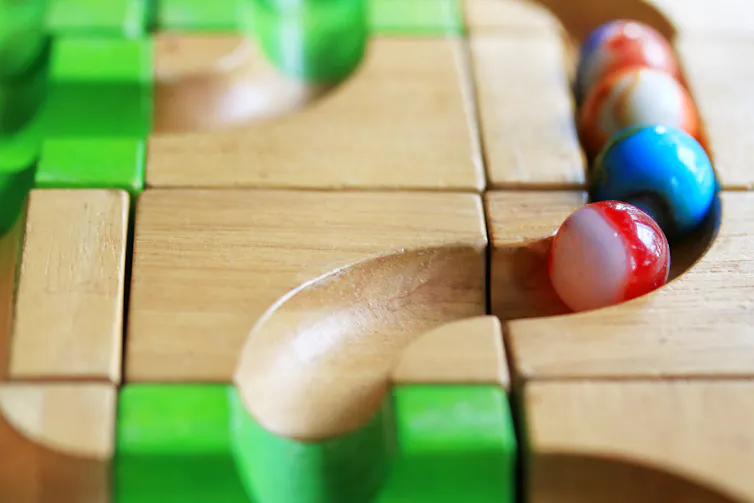 A toy marble on a track.