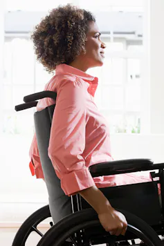 A young black woman using a wheelchair