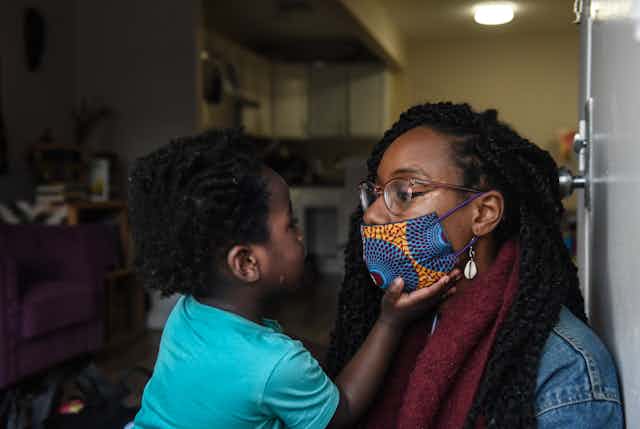 Sevonna Brown of Black Women's Blueprint, a mutual aid group, with her son in New York City. Mutual aid groups have formed in the city to address the economic plight caused by the pandemic.