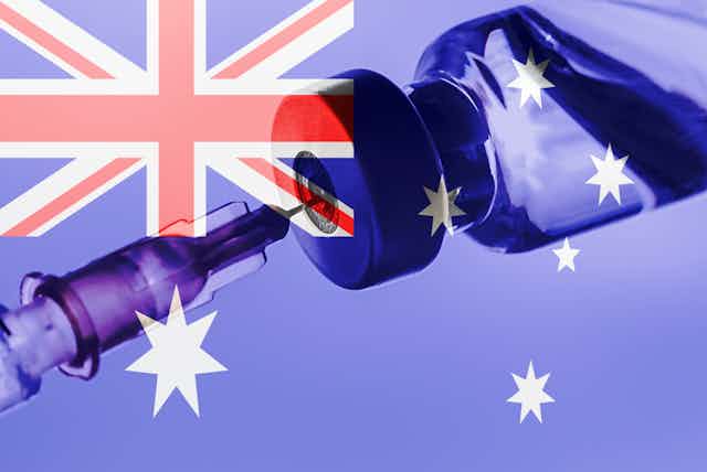 A vaccine vial with an Australian flag in the background.