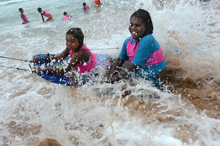 Two Aboriginal girl in the sea.