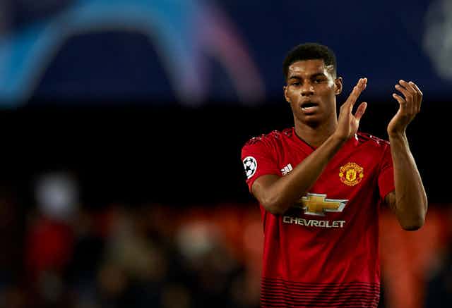 Marcus Rashford of Manchester United clapping his hands.