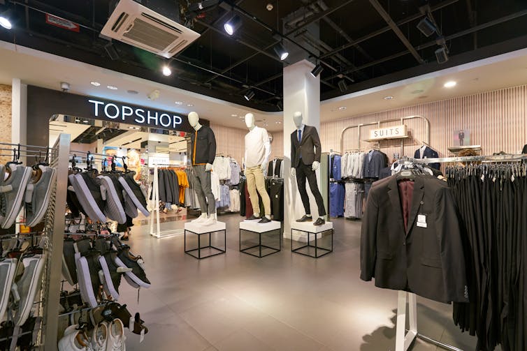 Shop floor of Topman with male mannequins and clothes.