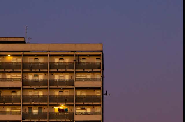 View of a tower block at dusk.