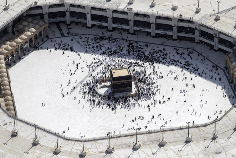 Muslim Hajj pilgrims at the Kaaba in Mecca, Saudi Arabia.