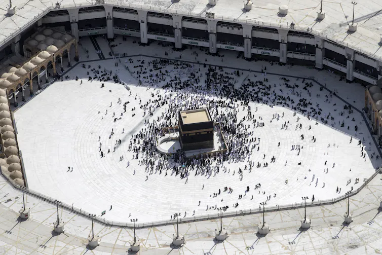 Muslim Hajj pilgrims at the Kaaba in Mecca, Saudi Arabia.