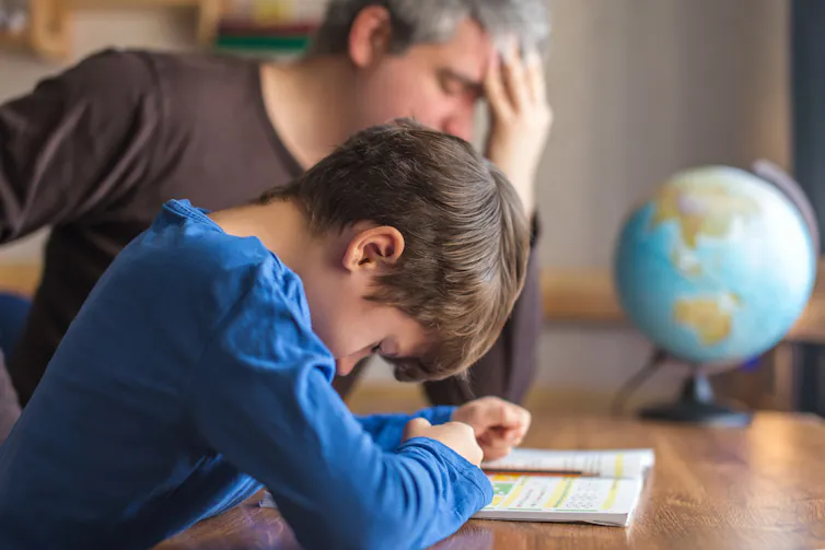 Father and son stressed over maths homework