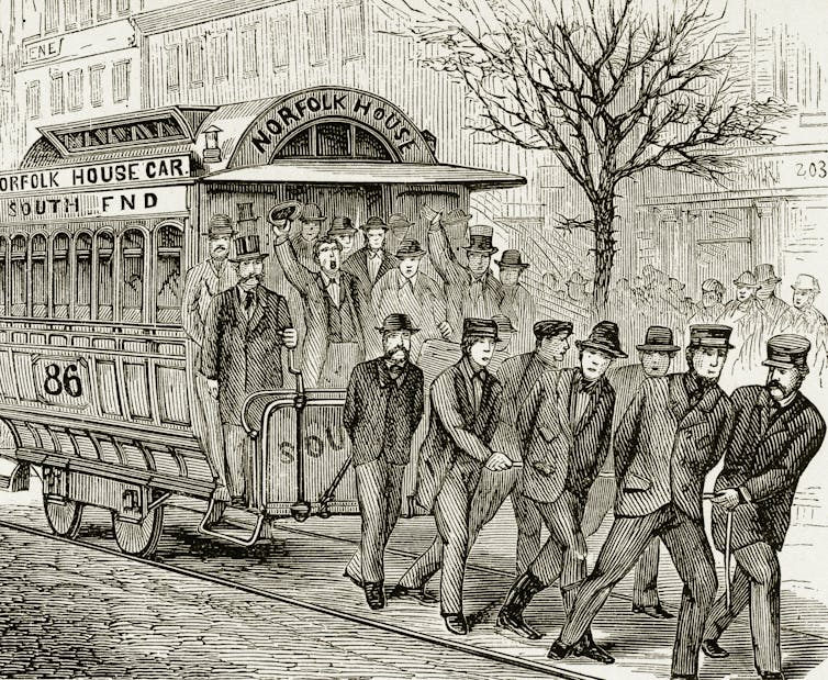 Engraving of men pulling a streetcar
