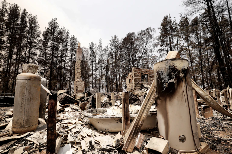 The charred bathroom of a house that burned in 2020.