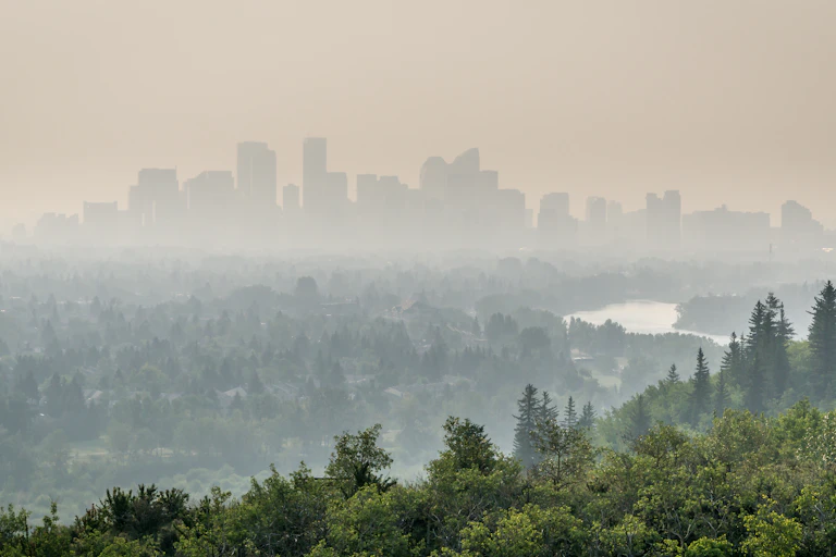 A hazy sky over a city.