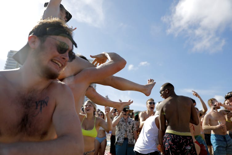 Young people partying on a beach in Florida.