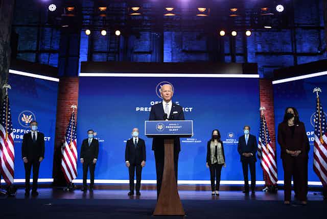 U.S. President-elect Joe Biden speaks on Nov. 24 with some of his cabinet picks standing behind him. 