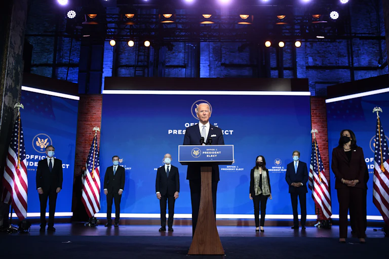 U.S. President-elect Joe Biden speaks on Nov. 24 with some of his cabinet picks standing behind him.