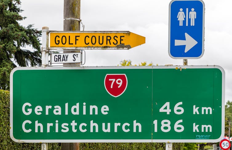 A road sign showing it's Geraldine in 46km and Christchurch 186km