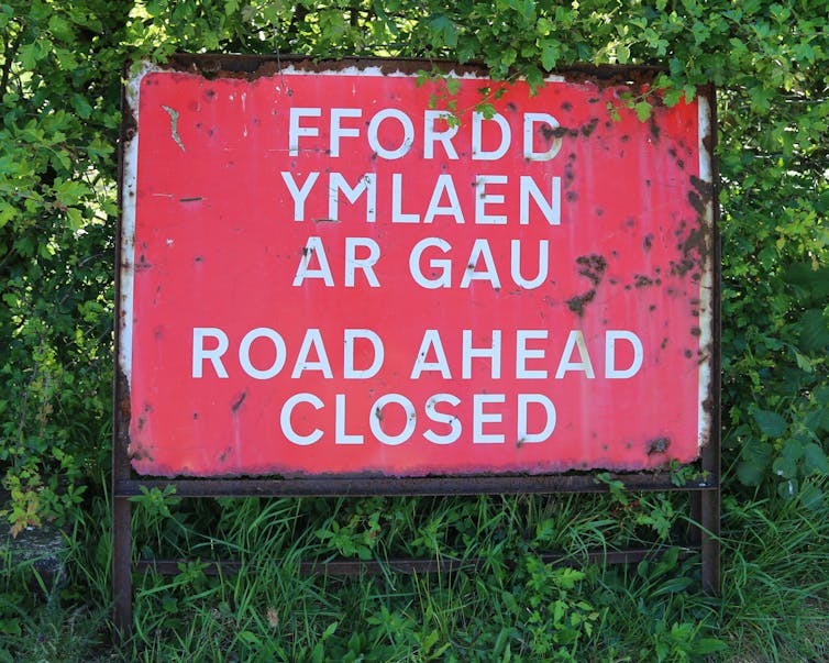 Bilingual Road Closed Ahead road sign in English and Welsh