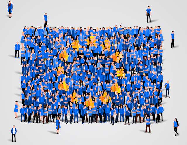 People gather wearing the blue and gold colours of the European flag.