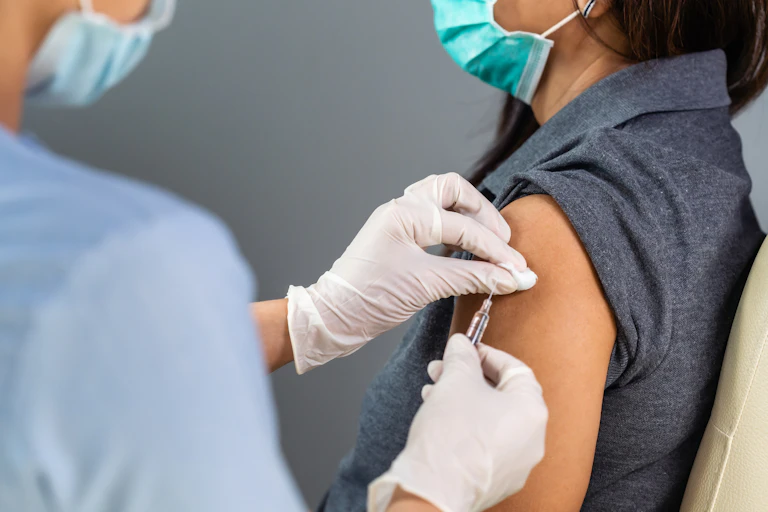 A person receiving a vaccine.