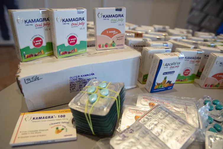 A collection of counterfeit medicines sit on a table at the ministry of finance in Berlin
