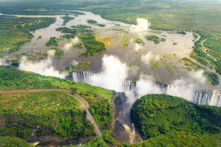 A huge waterfall surrounded by forests