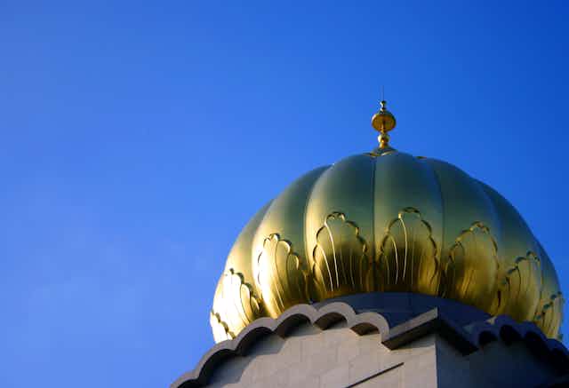 A golden dome of the Sri Guru Singh Sabha Gurdwara in Southhall, west London.