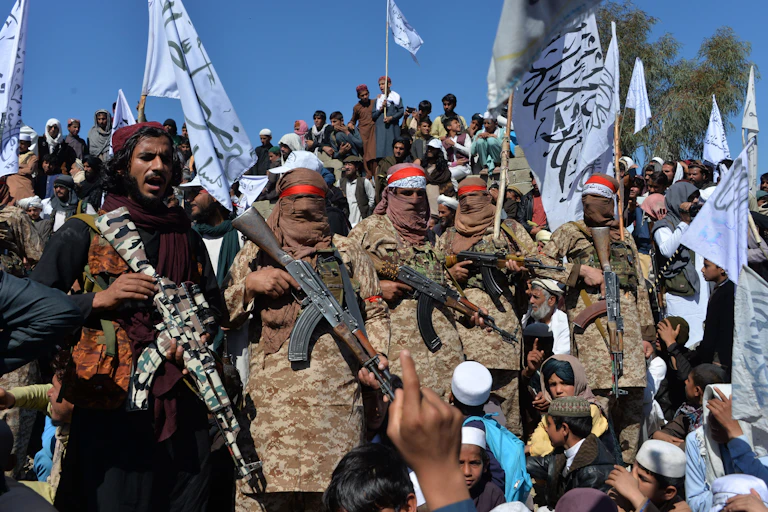 A crowd of armed fighters and civilians