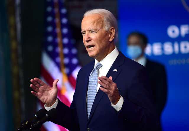 President-elect Joe Biden talking at a lectern.