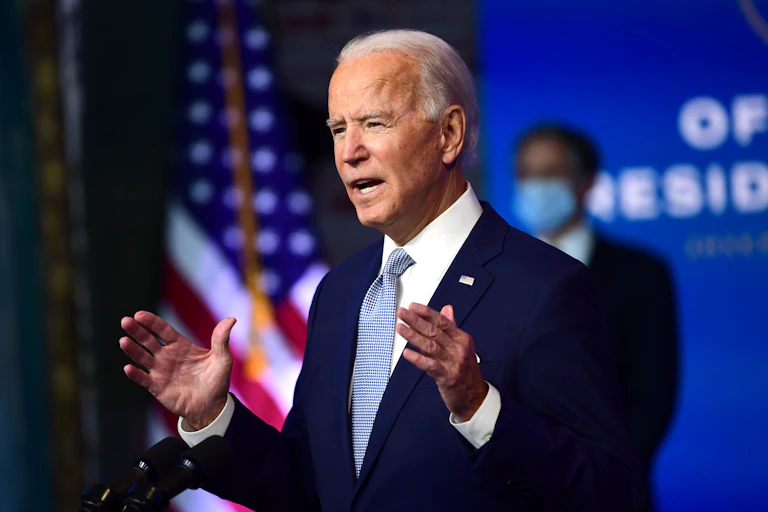 President-elect Joe Biden talking at a lectern.