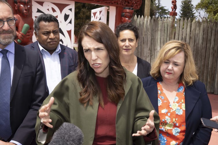 Jacinda Ardern and ministers speaking to media