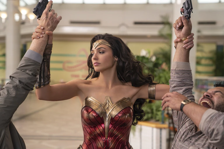 Wonder Woman stands between a fight.