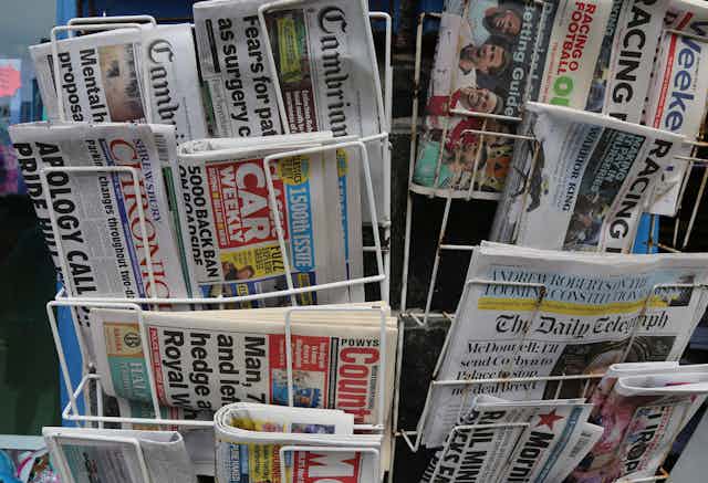 Newsstand with selection of local and national papers. 