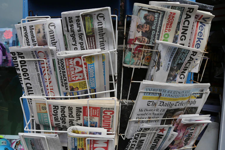Newsstand with selection of local and national papers.