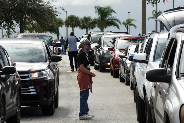 Cars lined up at a food distribution site in Florida.