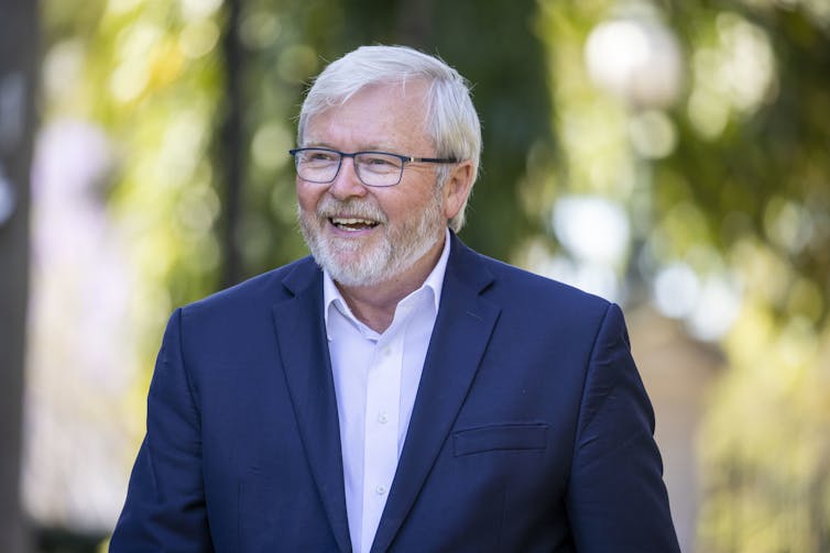 Kevin Rudd smiling, standing near the Brisbane City Botanic Gardens.