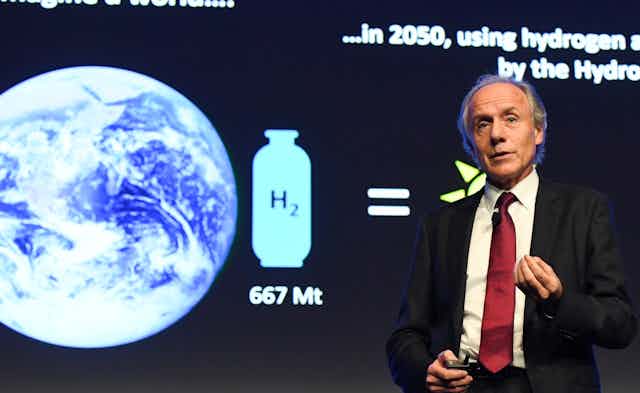 Australia's Chief Scientist Alan Finkel speaking on stage.