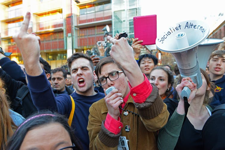 protesters attempt to disrupt a speech on campus