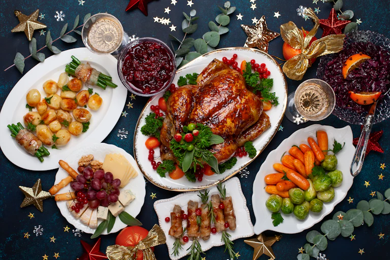 A Christmas dinner, with roasted turkey, brussel sprouts, potatoes, and cranberry sauce.