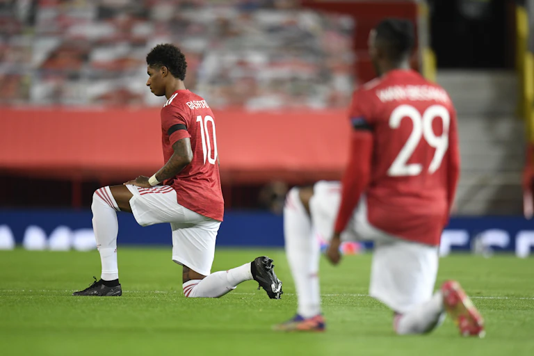 Footballers take a knee