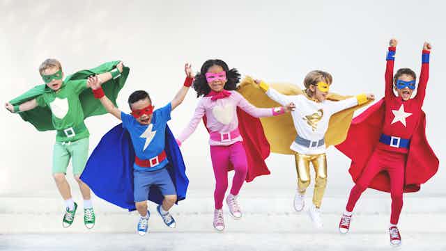 Children dressed as superheroes. 