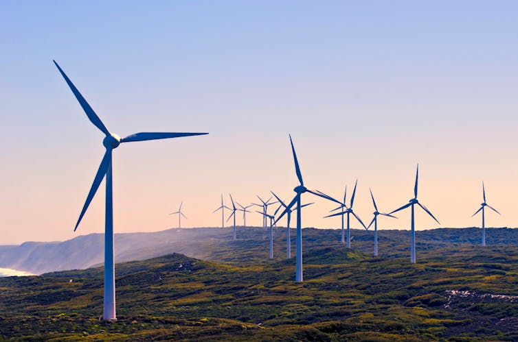 Wind turbines against a sunet