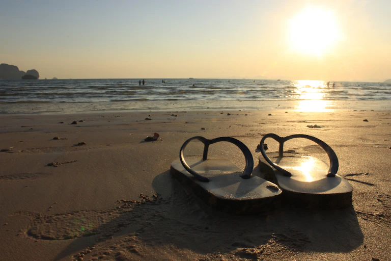Rubber thongs on beach